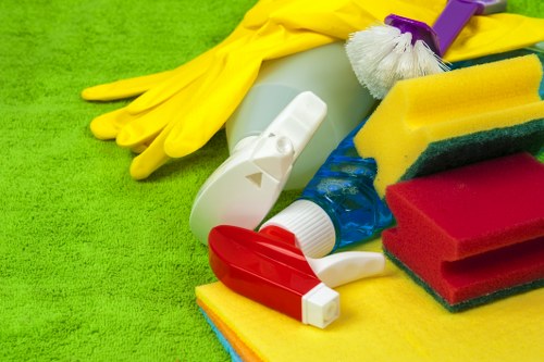 Professional cleaners maintaining shared office kitchen facilities