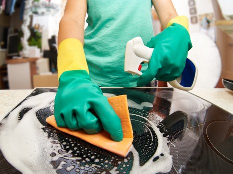Professional cleaner working in a Hammersmith flat near local residential streets